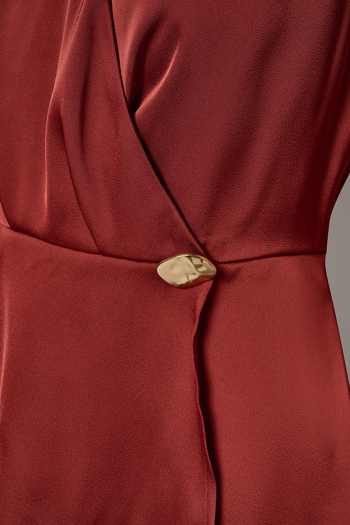 SLEEVELESS WRAP-EFFECT ASYMMETRIC PEPLUM BLOUSE - Sunbaked